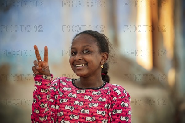 Aswan, Egypt. December 10th 2022 Pretty happy smiling young Nubian girl in the Nile side Nubian