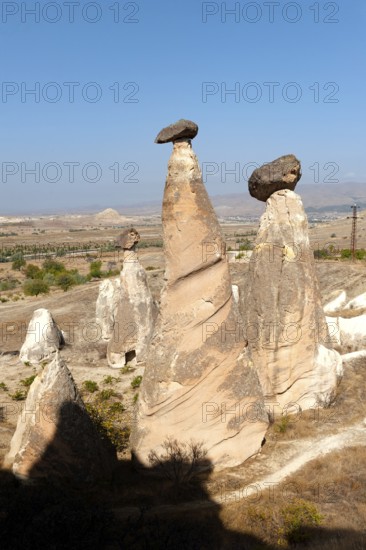 Beautiful morning light on the fairy chimney rock formations known as the Three Graces, part of the