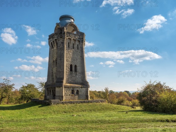 The Bismarck Tower at Großer Fallstein in autumn under a blue sky with fair weather clouds,