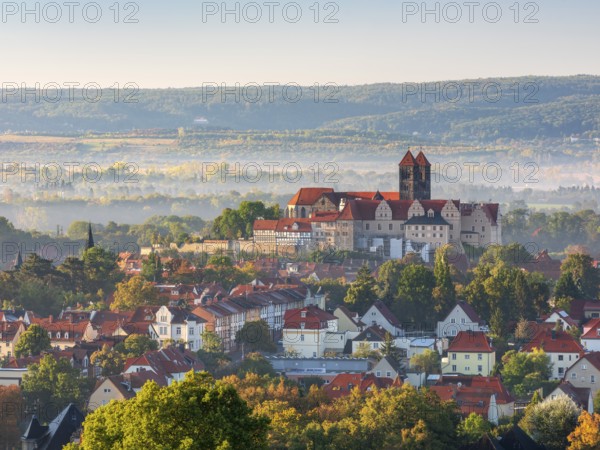 View of Schlossberg with St. Servatius Collegiate Church in morning light and fog in autumn, UNESCO