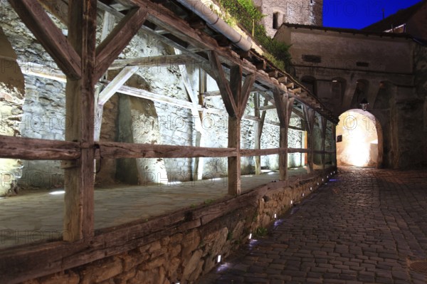 Romania, the way through the hour tower at blue hour in the historic old town of Sighisoara, German