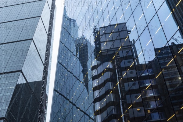 Modern abstract reflections in glass fronted commercial office buildings in the financial district