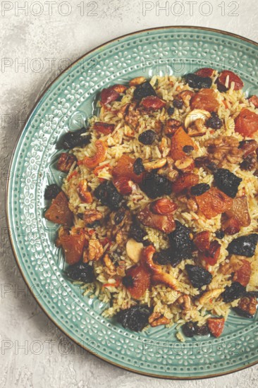Rice dish, with the addition of dried fruits, nuts and spices of Middle Eastern cuisine, homemade,