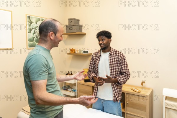 Two men engaging in a friendly and professional conversation about health and wellness, consulting