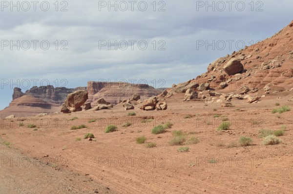 Barren desert landscape with red rock formations and sparse vegetation, Grand Canyon National Park,