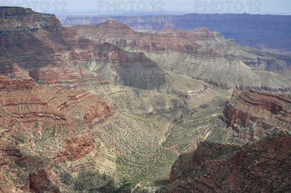 Steep canyons and valleys stretch through an earthy and vast landscape, Grand Canyon National Park,