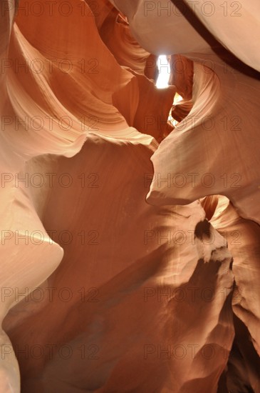 Light transmission through narrow openings in the curved sandstone canyons of a sandstone canyon,