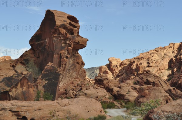 Large red sandstone rock formation in the desert with clear sky in the background, Valley of Fire