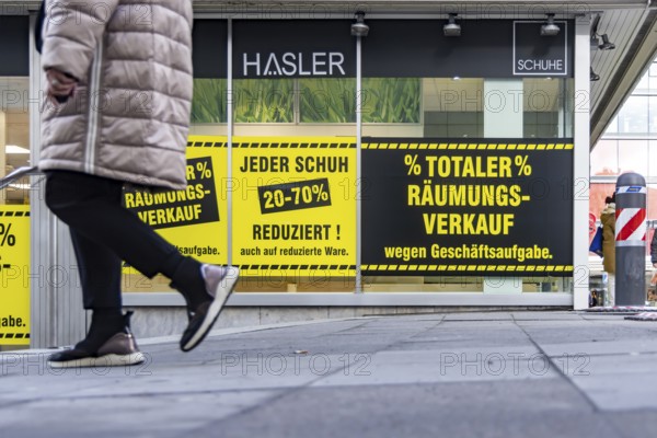 Clearance sale in the city center. A shoe store offers discounts on sales. Stuttgart,