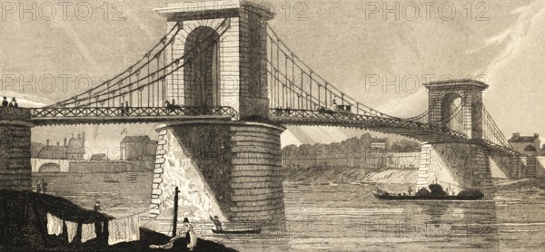 Suspension bridge in the Alsatian fields near Paris, France, construction, clothesline, city wall,