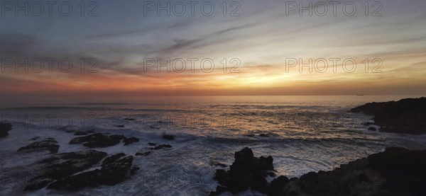 Calm sunset over the sea, soft colors in the sky and views of rocks, hiking on the Fisherman's