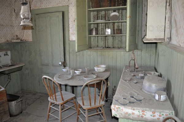 Dusty kitchen, vintage kitchen with old dishes and furniture in an abandoned setting, Bodie Ghost