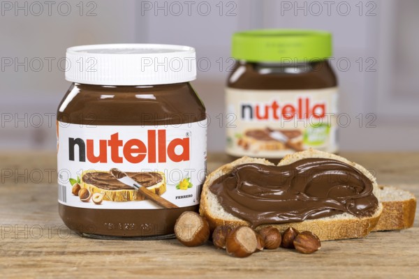 Nutella and Nutella Plant Based vegan nut nougat cream jar on bread with logo in Stuttgart, Germany