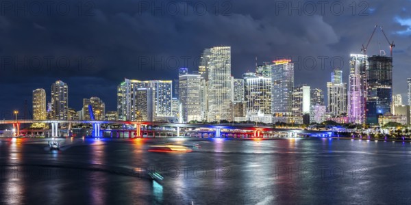 Miami skyline with high-rise real estate in downtown panoramic ocean view at night in Miami, USA