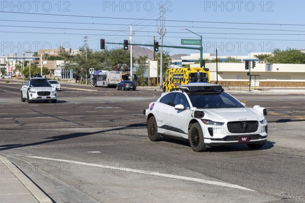 Waymo self-driving autonomous vehicles driverless cars from Google and Jaguar Robotaxi in Phoenix,
