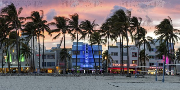 Miami Beach Florida building on Ocean Drive in art deco architecture style panorama at night in