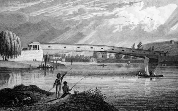Large bridge over the Schuylkill River, Philadelphia, USA, fisherman on the shore, rowing boat with