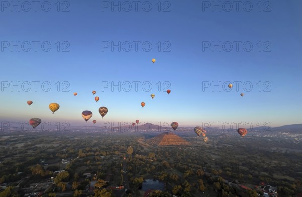 Panoramic aerial view of Mexico Teotihuacan pyramids. Hot air balloons flying over the Mexican