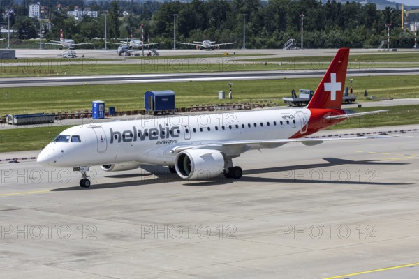 An Embraer 190 E2 Helvetic Airways aircraft with the HB-AZA license plate at Zurich Airport,