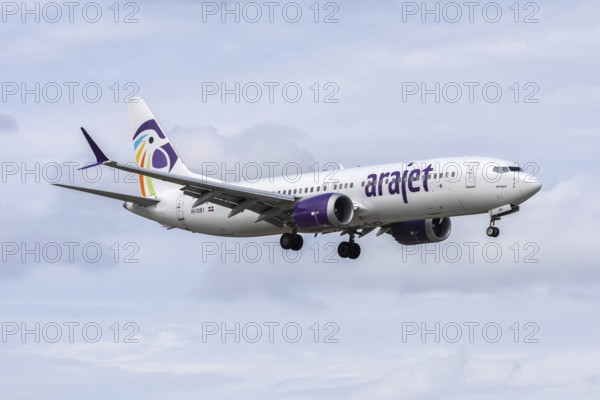 An Arajet Boeing 737-8 MAX aircraft with license plate HI1081 at Miami airport, USA