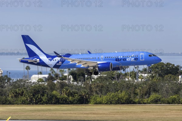 An Airbus A220-300 Breeze Airways aircraft with license plate N218BZ at Tampa airport, USA
