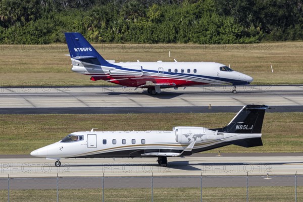 Bombardier Learjet and Cessna Citation Latitude private jet aircraft with license plate N85LJ at