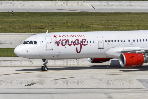An Air Canada Rouge Airbus A321 aircraft with the license plate C-GHPJ at Fort Lauderdale airport,