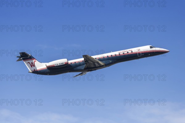 A Western Air Embraer 145 aircraft with the license plate C6-SAW at Fort Lauderdale airport, USA