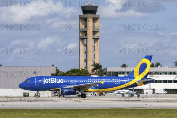 A JetBlue Airways Airbus A320 aircraft with license plate N775JB and JetBlue Honors our Veterans