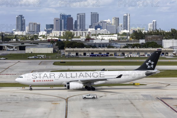 An Air Canada Airbus A330-300 aircraft with the license plate C-GHLM and Star Alliance special