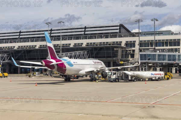 A Eurowings Europe Airbus A320 aircraft with the license plate 9H-EWC at the airport in Stuttgart,