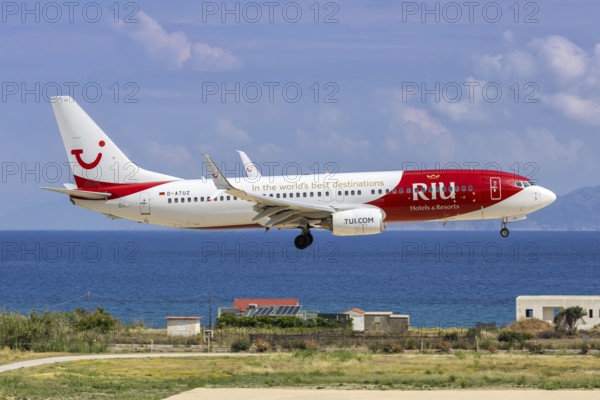 A TUI Boeing 737-800 aircraft with the D-ATUZ license plate and RIU Hotels & Resorts special livery