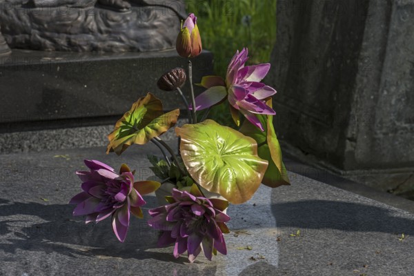 Artificial flower decoration on a grave, Lützenhofer cemetery Lychakivsky cemetery, Lviv, Galicia,