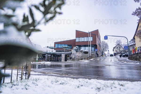 Modern architecture town hall, in a snowy town, quiet atmosphere with snowy street, Gechingen, Calw