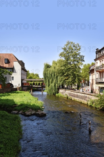 Ettlingen, Germany - August 13th 2025: Alb brook in historic center of Ettlingen, Germany. Small