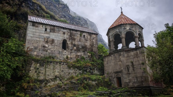 An old monastery with picturesque stone architecture nestled in a mountainous landscape, Debed