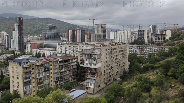 Panoramic view of a residential area with construction cranes and high-rise buildings, Tbilisi,