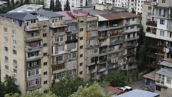 Multi-storey residential building with several balconies in the city, residential silo,