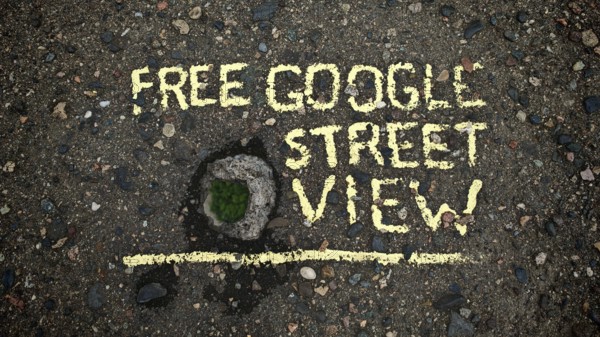 Concrete bridge with hole in asphalt with yellow text 'Free Google Street View, 'funny, Tbilisi,