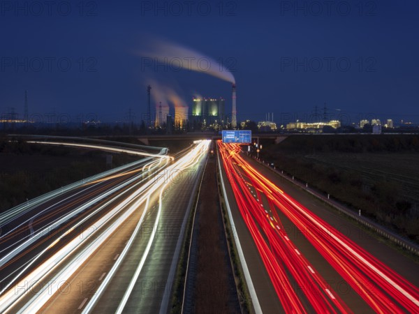 Night shot, long exposure, light trails on the A38 motorway, Schkopau power plant in the back,