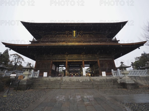 Large traditional temple in Japan, illuminated at night, majestic and impressive, Zenko-ji Temple,