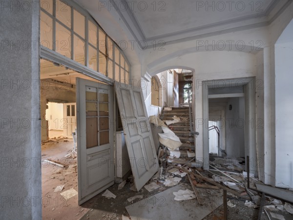 Staircase of an abandoned administration building full of rubble and trash, Lost Place,