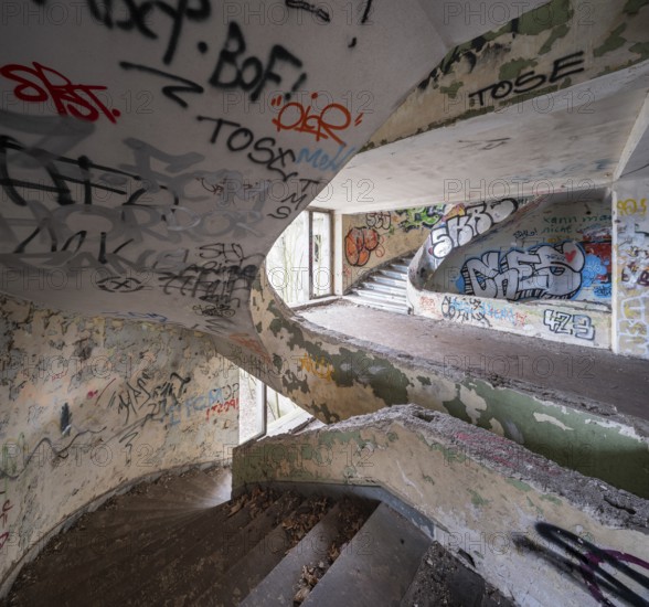 Dilapidated stairwell full of graffiti in a former FDGB holiday home, Lost Place, Saxony-Anhalt,