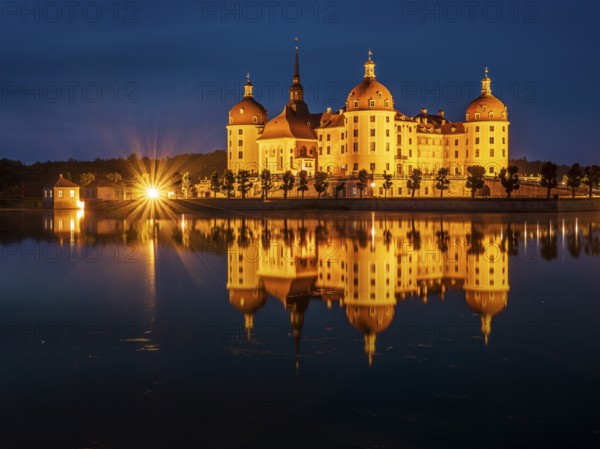 Moritzburg Castle, Augusts the Strong hunting lodge at dusk, water reflection in the lake, Saxony,