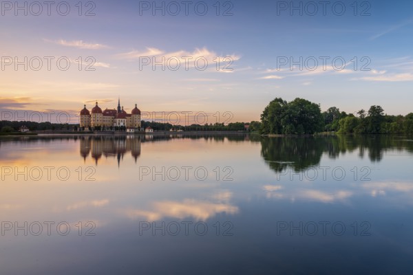Moritzburg Castle, Augusts the Strong hunting lodge at dawn, water reflection in the lake, Saxony,