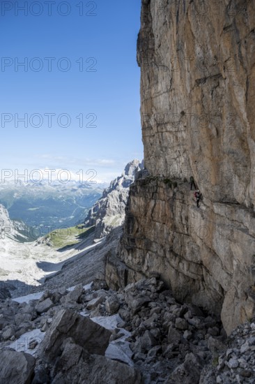Mountaineers on the Bocchette Centrale band trail, via ferrata in the Brenta Mountains,