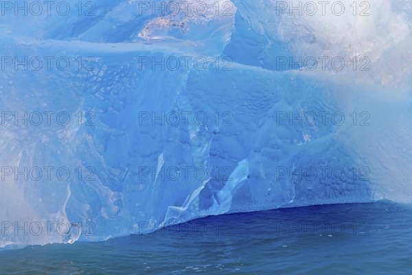 Blue ice wall of Idabreen, Ida glacier calving into Liefdefjorden at Idabukta bay, Haakon VII Land,