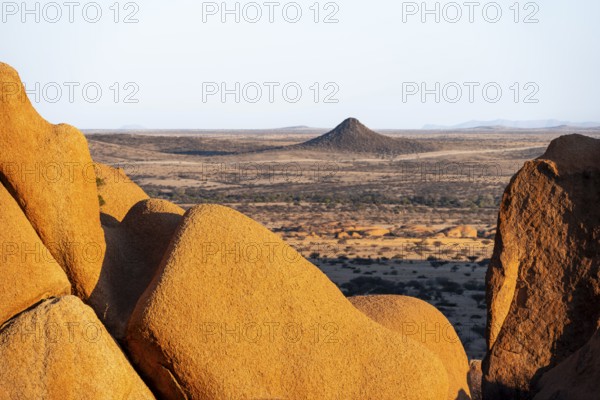 Impressive rock formations offer a wide view of the dry desert plain of Spitzkoppe, Spitzkoppe,