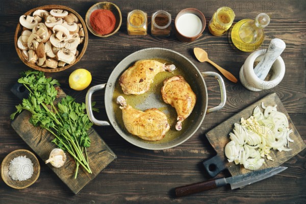 Top view of chicken poultry browning in oil. Culinary process of making dinner with sliced