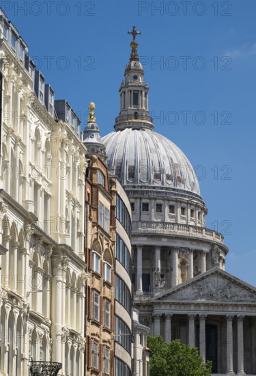 Lugate Hill Street with historic buildings and the dome of St. Paul's Cathedral in the background,